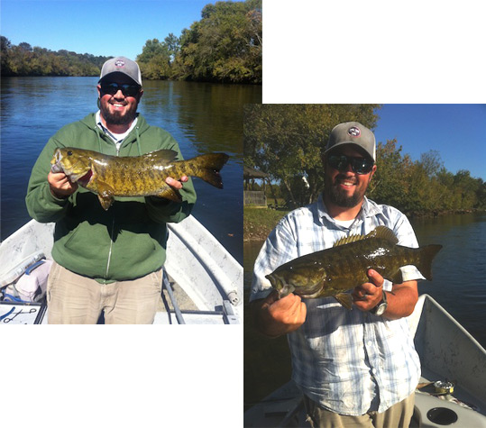 Josh Pfeiffer holding two large smallmouth bass.